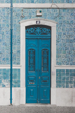 blue wooden door closed with 46 sign