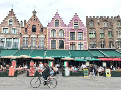 A vibrant European city street bustling with colorful buildings and lively cafes