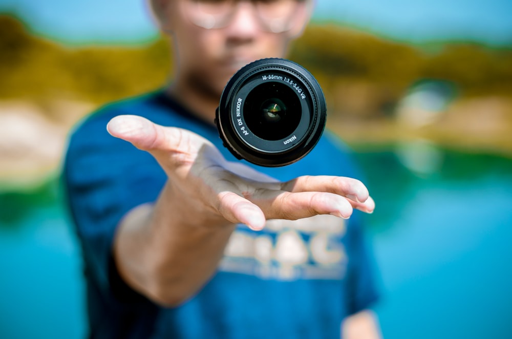 a man holding a camera in his hand