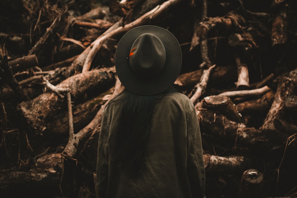 person in front of tree branches