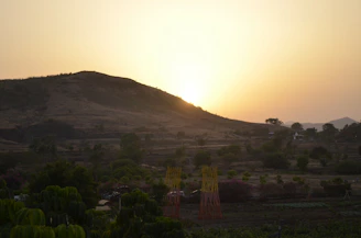 A sunset view over the agro-pastoral land, symbolizing hope and renewal.