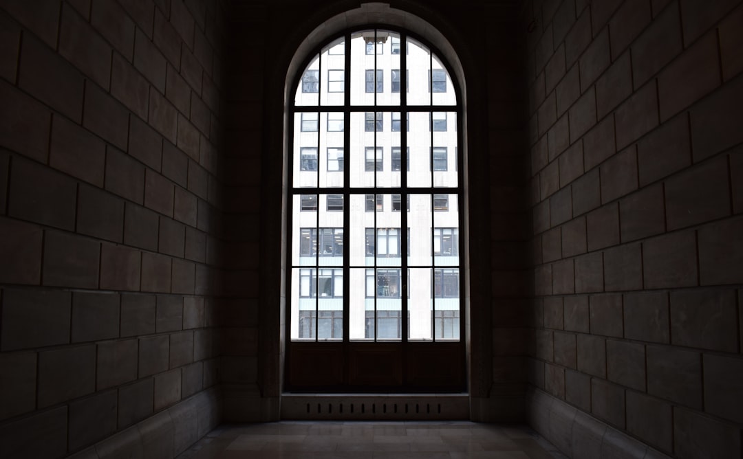 brown wooden framed glass window