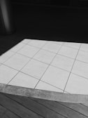 A contrast of colors and patterns in flooring materials.