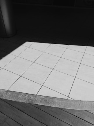 A contrast of colors and patterns in flooring materials.