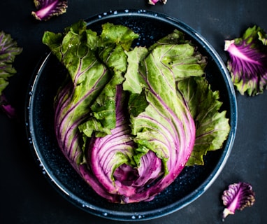 purple and green vegetable in black bowl