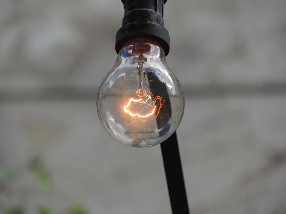 selective focus photography of light bulb