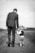 man walking holding boy