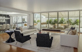 two black suede armchairs during daytime