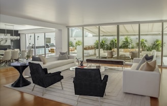 two black suede armchairs during daytime