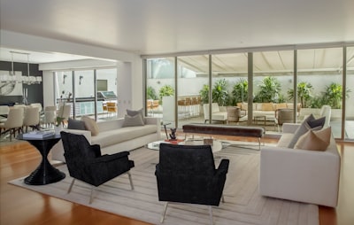 two black suede armchairs during daytime interior design zoom background