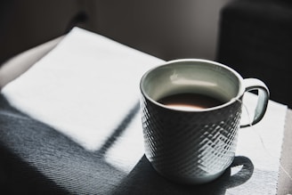 selective focus photography of mug