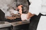 A chef preparing high-quality ingredients for burgers.