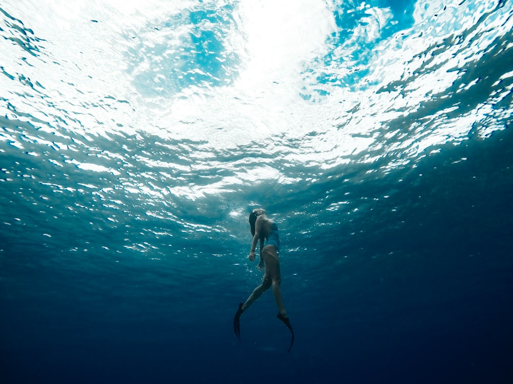 woman swimming underwater