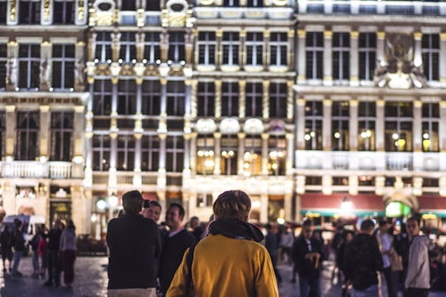 A diverse group of citizens gathered in a lively town square, engaging in conversation.