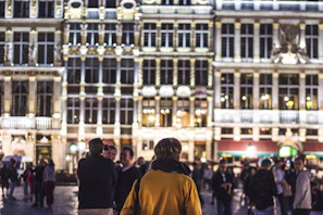 A lively community gathering in a rustic town square, sharing stories and laughter.