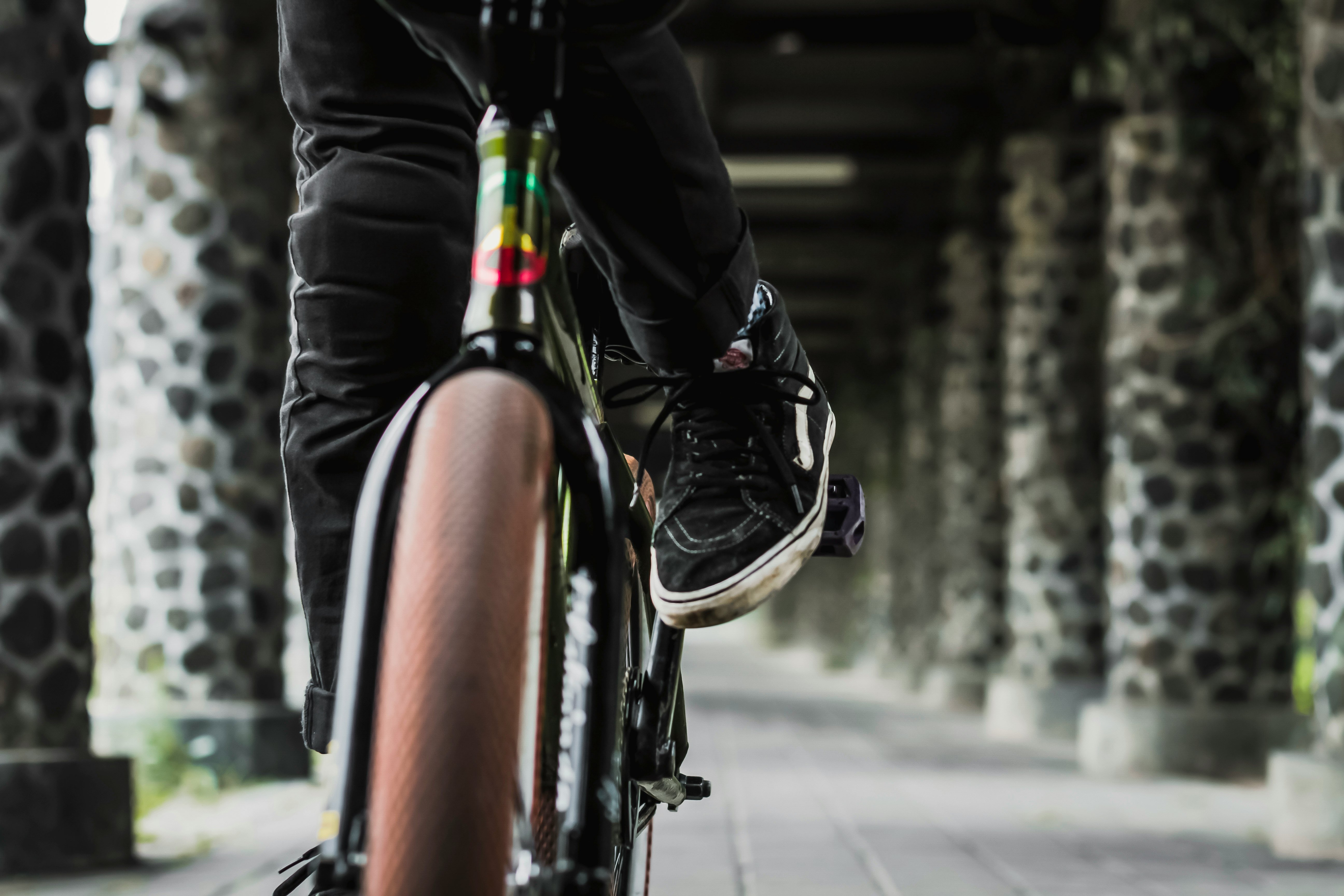 person riding bicycle on hallway