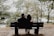 A couple enjoying a peaceful moment in nature, reflecting their bond.