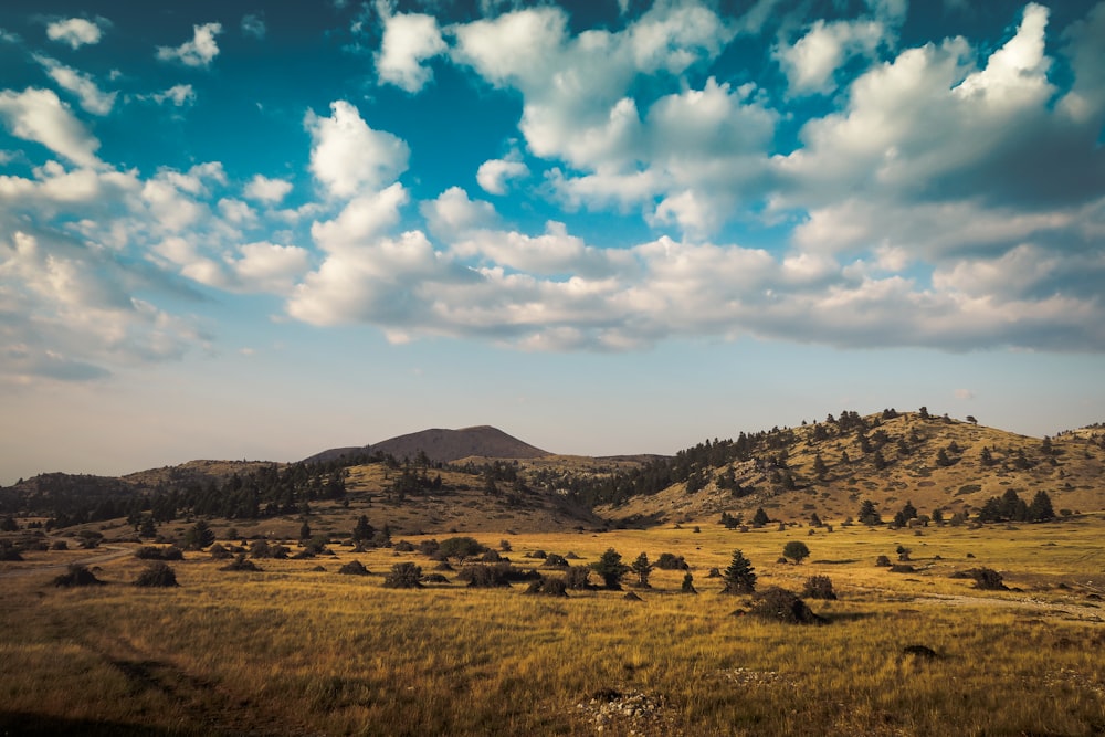 mountain under cloudy sky during daytime