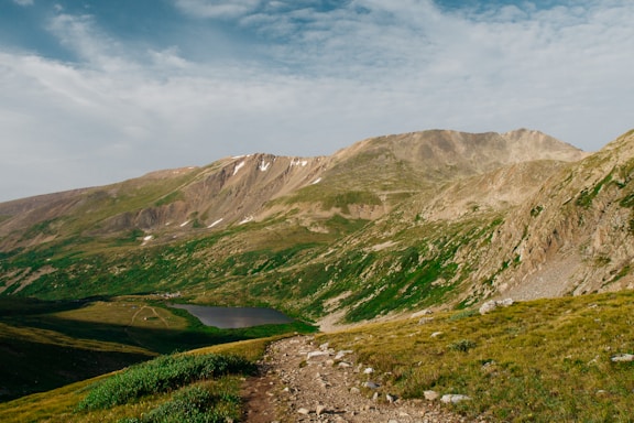 A scenic mountain biking trail winding through the Andes foothills near Santiago, Chile.