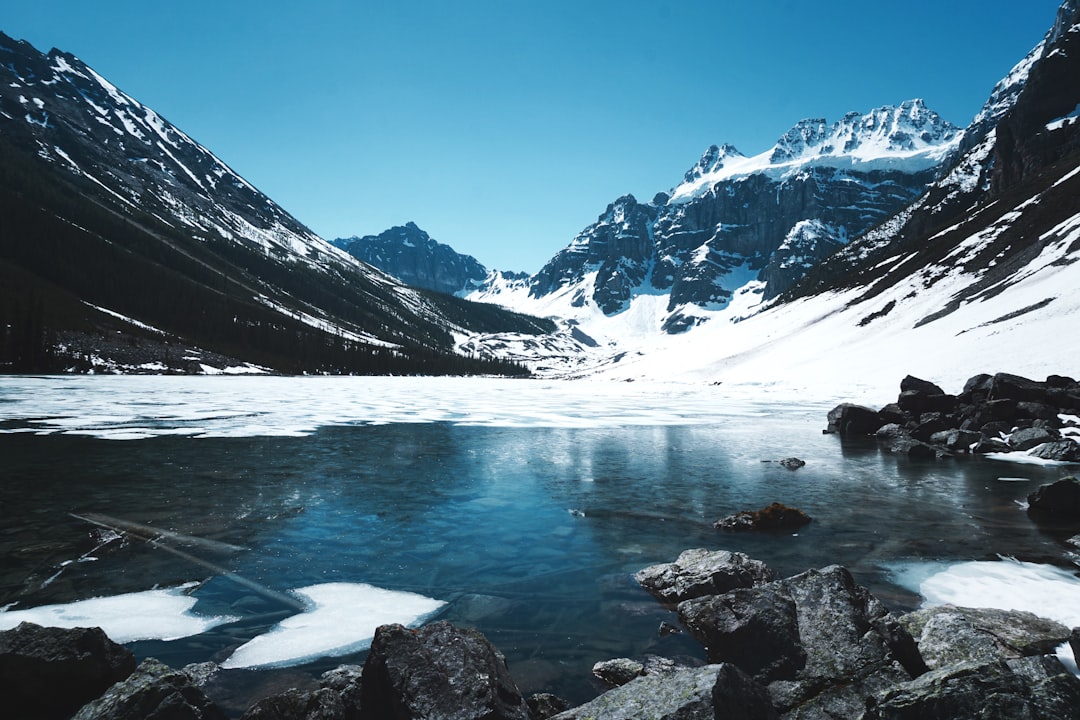 body of water in the middle of mountains,