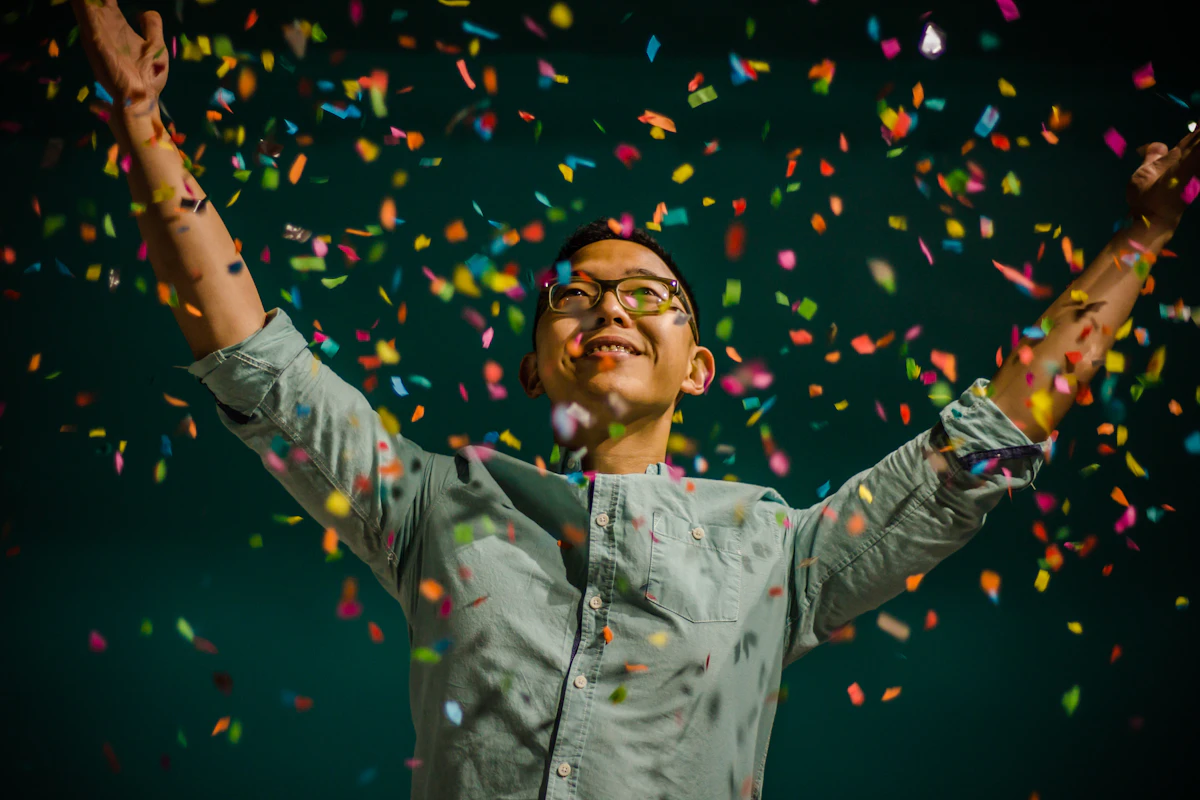 Person throwing confetti in celebration