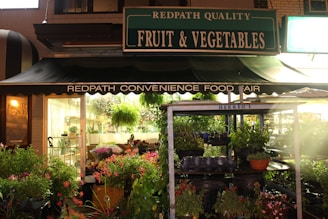 A bright, welcoming storefront of Mars Mini Mart with fresh produce displayed outside.