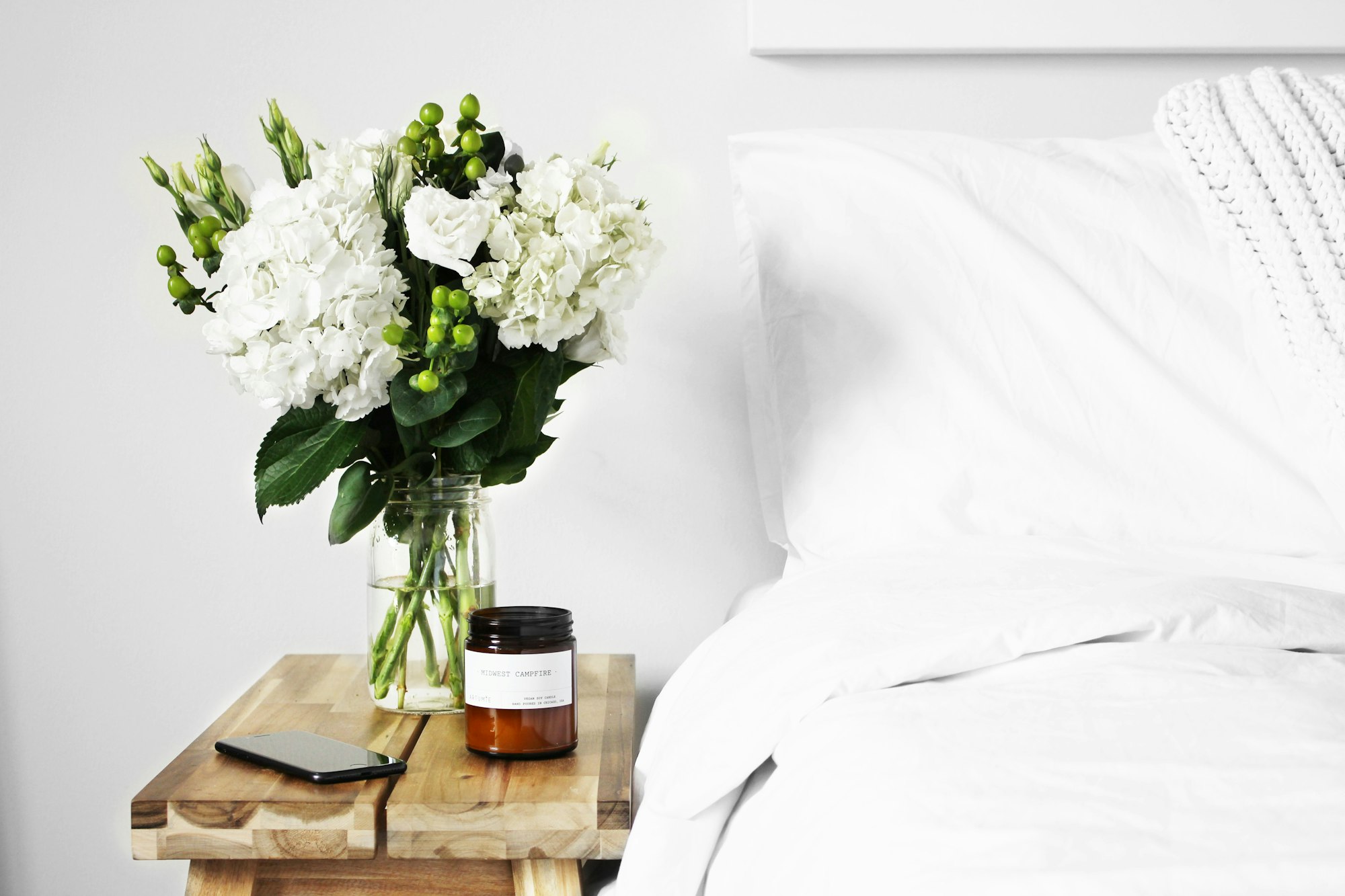 Is there anything better than all-white bedding? It makes me feel like I’m sleeping on a cloud. I made this fresh flower arrangement from flowers I bought at a local shop and had to take a photo.