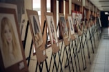 assorted paintings on white room