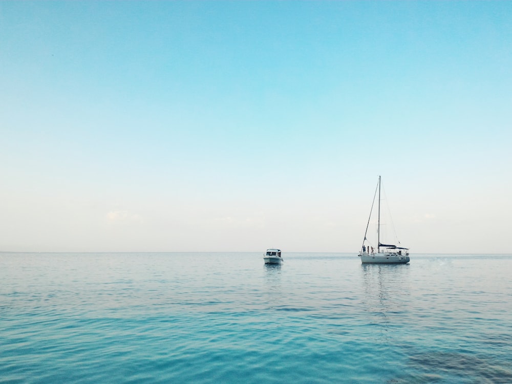 two boats docked on ocean