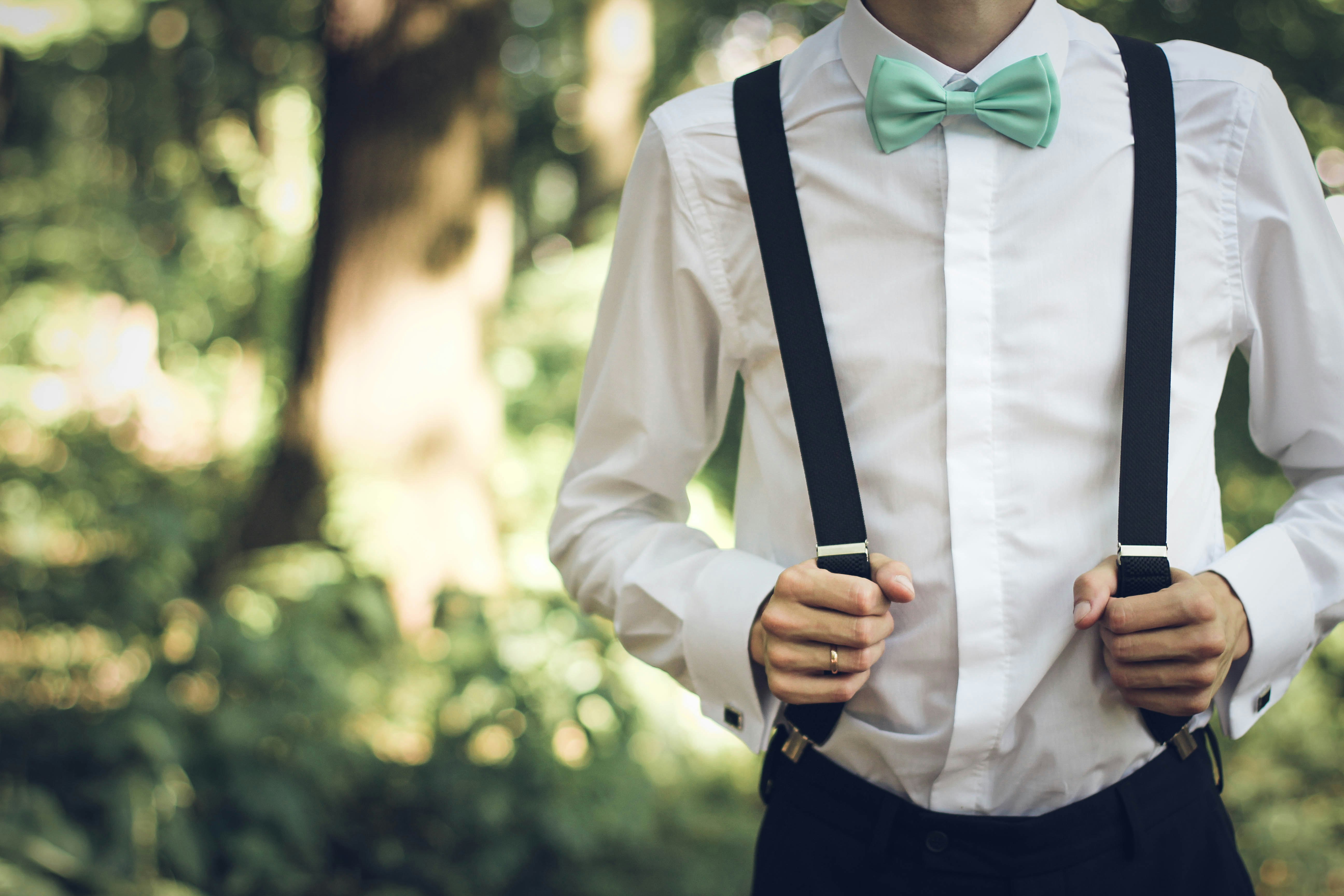 Wearing suspenders and bowtie