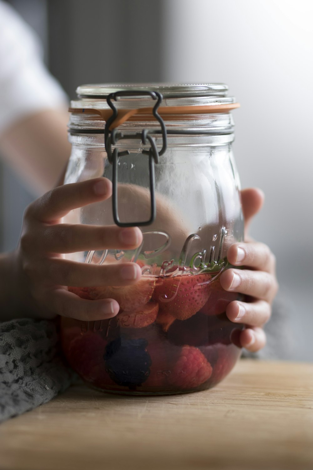 clear glass jar with red liquid inside