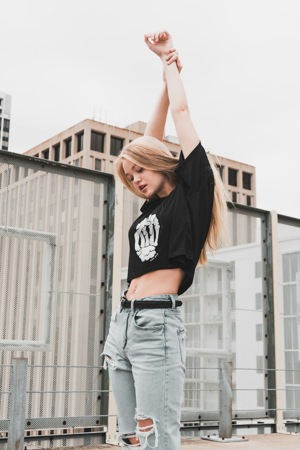 woman stretching her arm upward