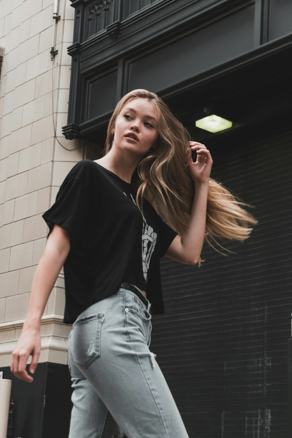 woman walking near building