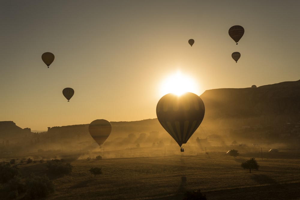 silhouette of hot air balloons in the sky