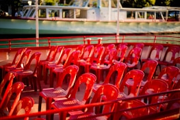 Before and after shots of a boat’s worn-out seating transformed with new upholstery.
