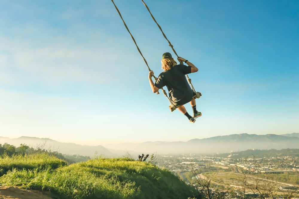 women riding swing