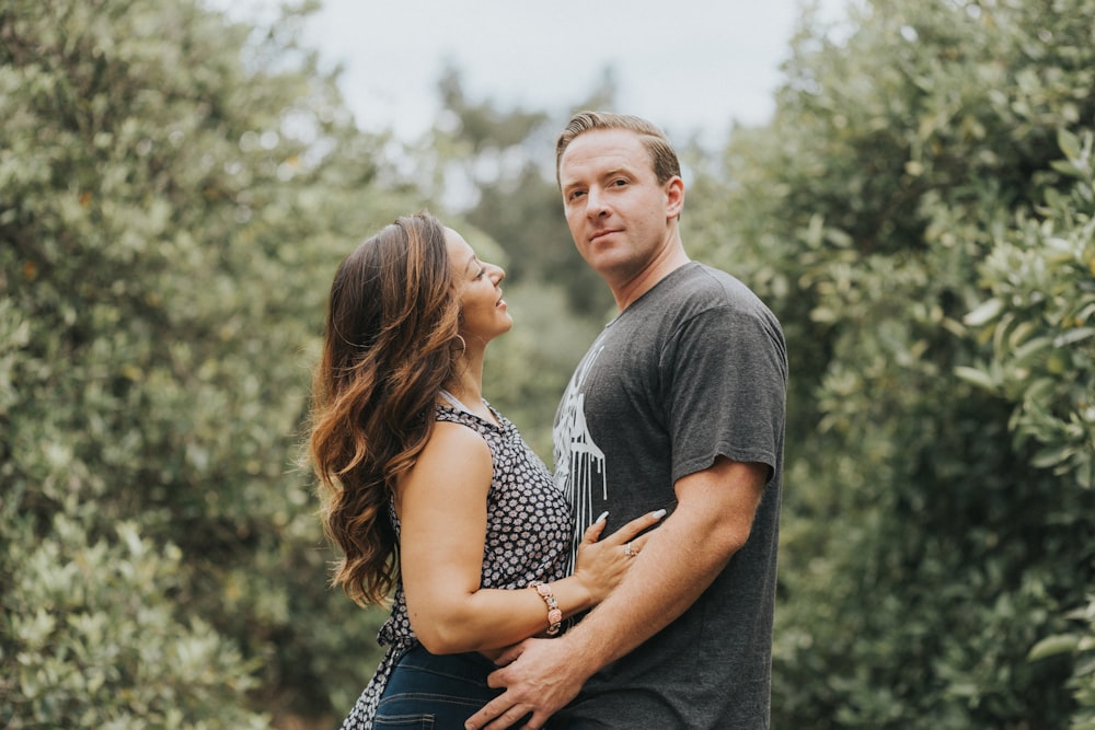 man and woman hugging during daytime