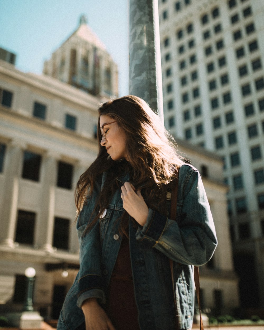 woman standing facing on right side near building