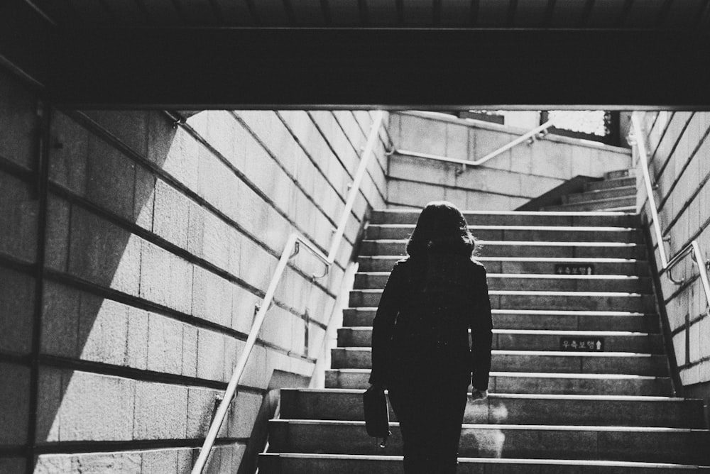 woman going upstairs