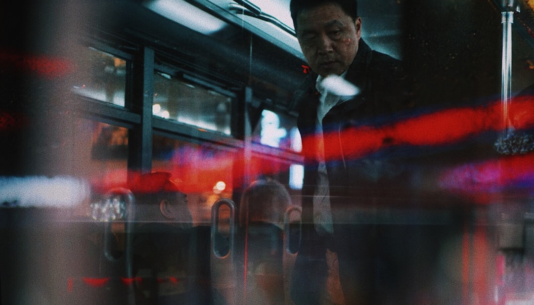 man standing near glass door