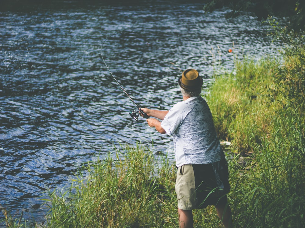 man fishing on river