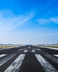 airplane road under cumulus clouds