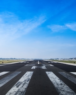airplane road under cumulus clouds