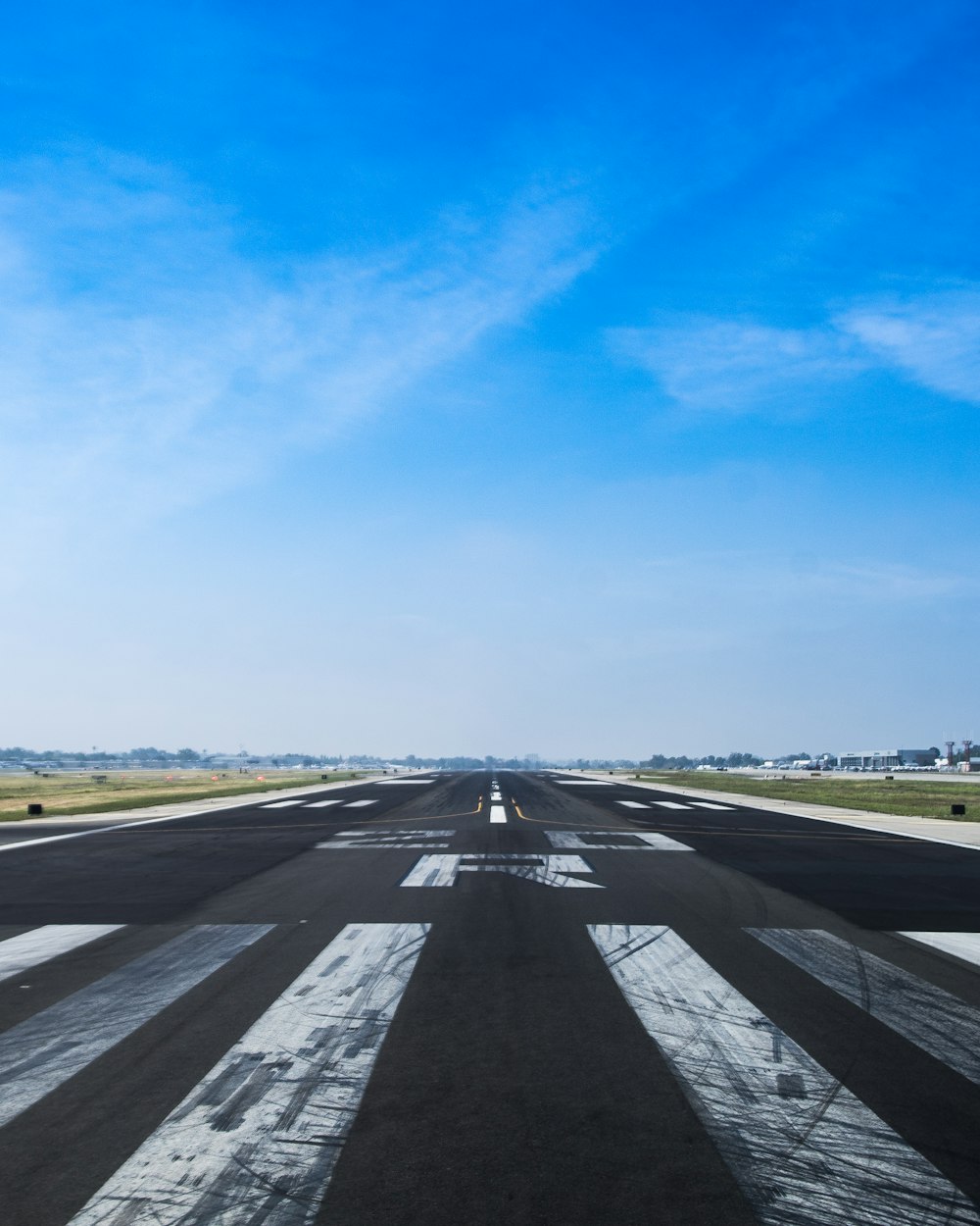 airplane road under cumulus clouds