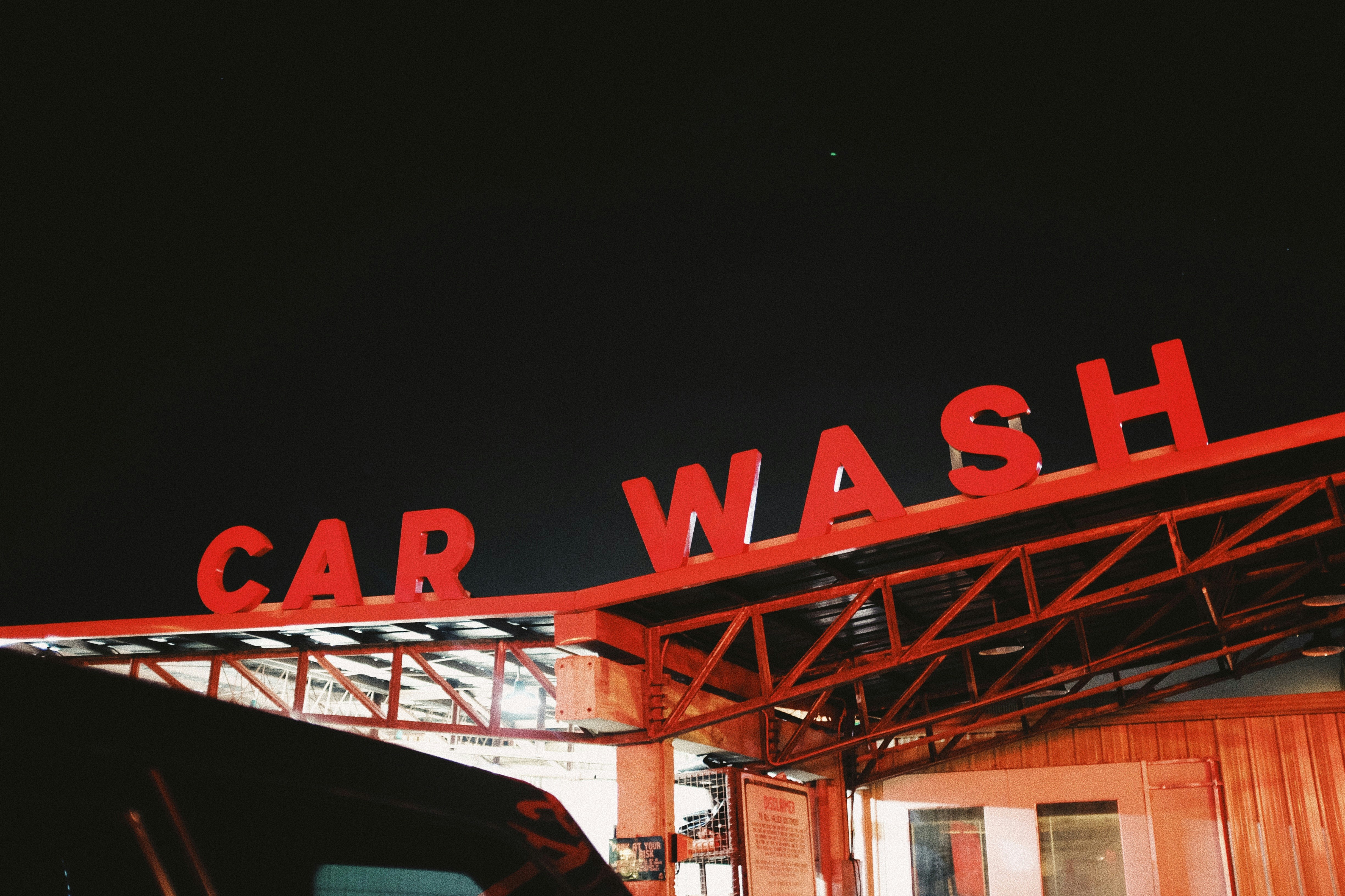 red Car Wash cutout signage on top of roof