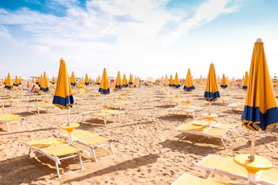 seashore with lounger and patio umbrella