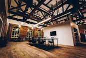 Dynamic team meeting in a stylish industrial-luxury office space.