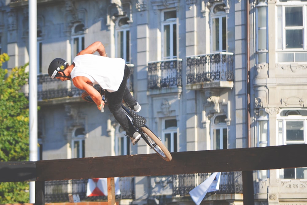 man riding bike doing stunt