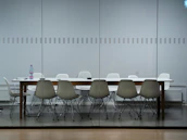 A conference room with neatly arranged Apple devices and network equipment ready for use.
