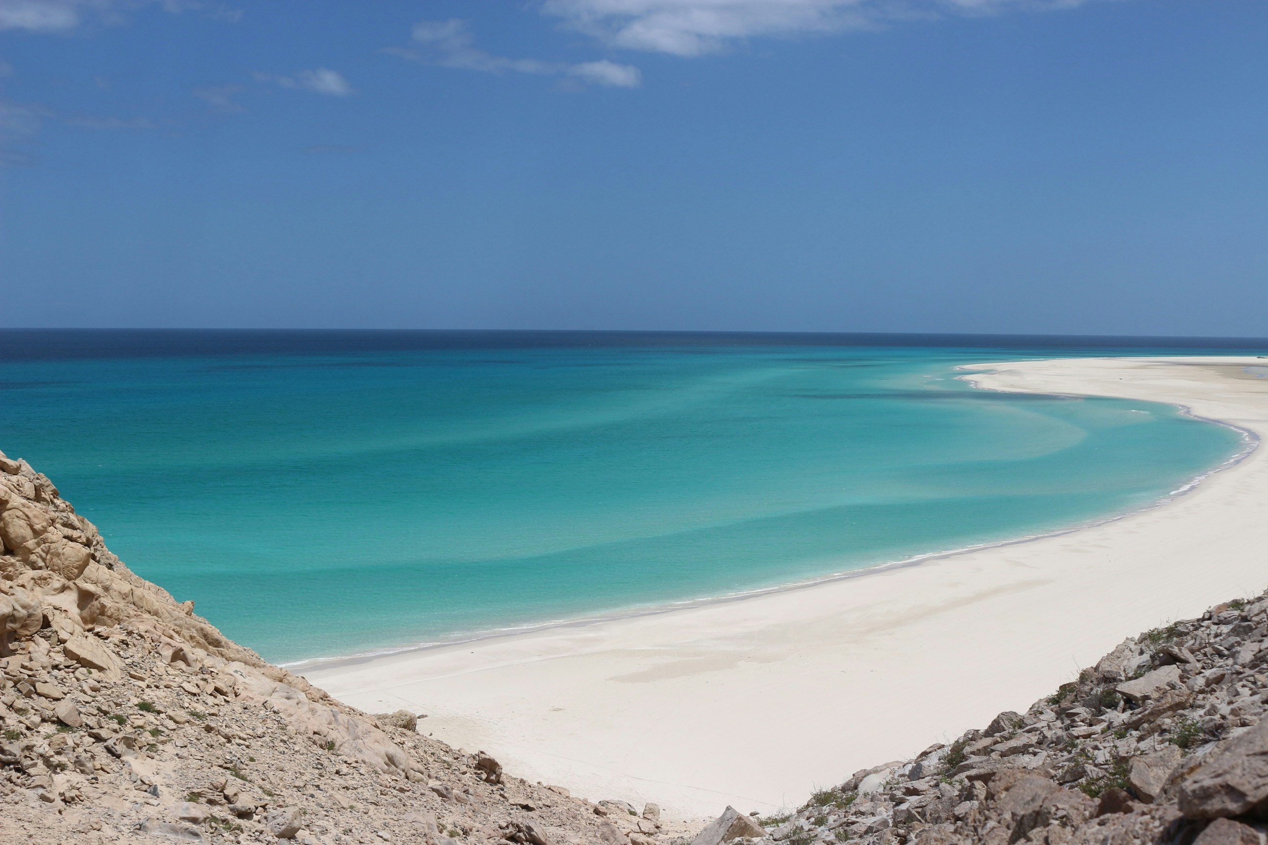 landscape photo of seashore under blue sky